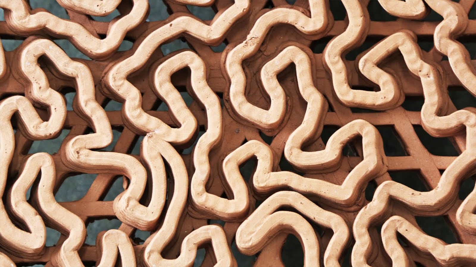 Macro detail of a 3D-printed terracotta reef tile's biomimetic structure