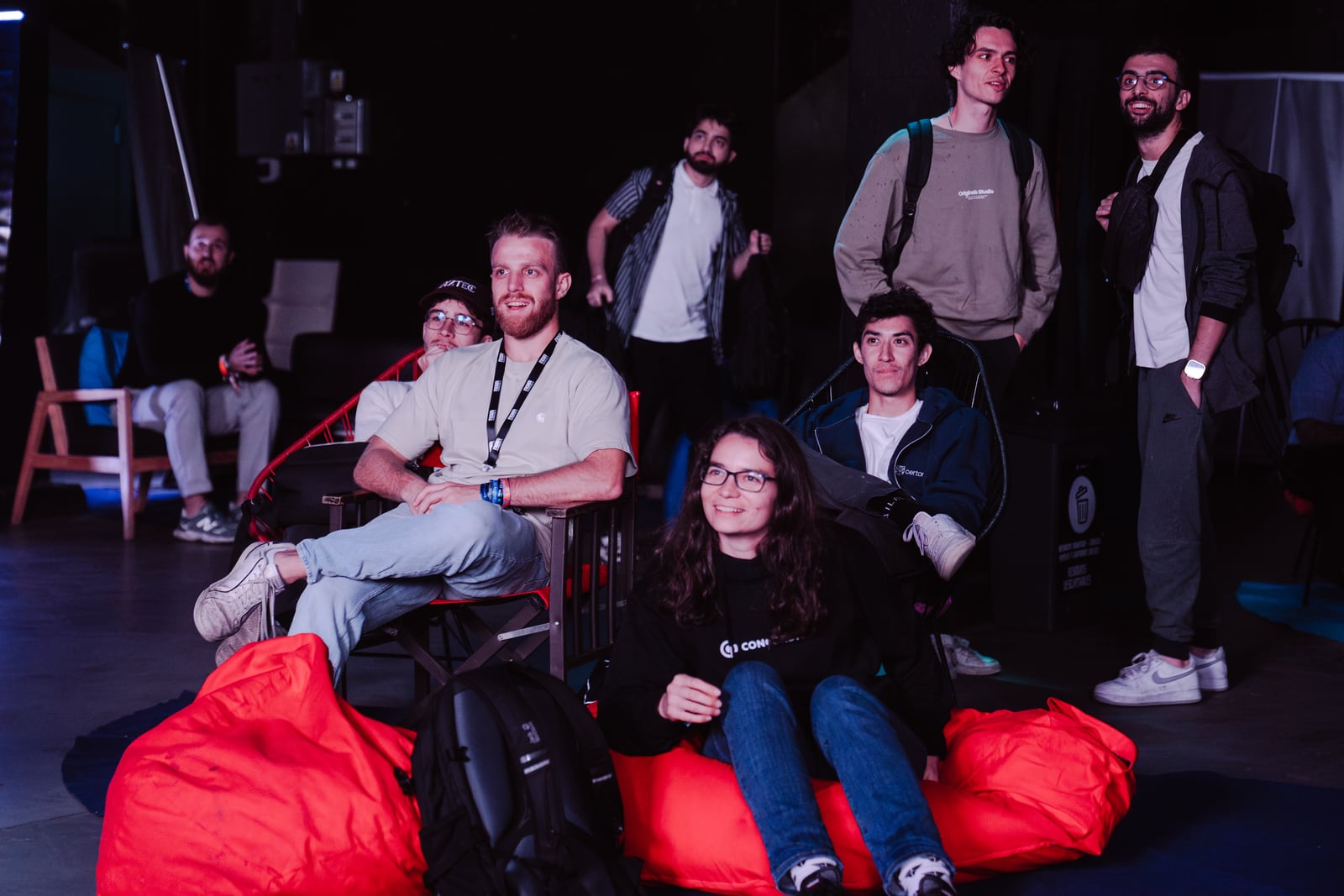 Audience seated on beanbags watching the competition